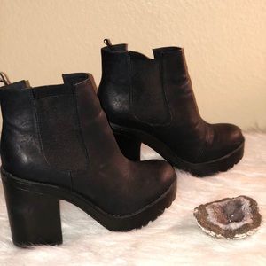 Tall heeled black boots